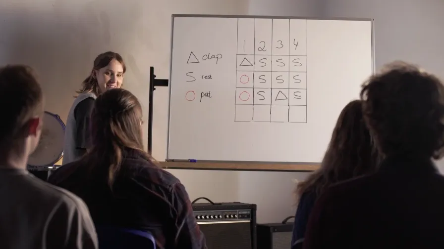 Close-up of hands using a desk as a drum kit for advanced Rock and Funk rhythms